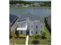 Beautiful two-story home with water view, modern design with stone accents and well-manicured landscaping at 2855 Bookmark Dr, Kissimmee, FL 34746