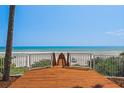 Wooden walkway leading to a pristine beach and the ocean at 3309 Hill St, New Smyrna Beach, FL 32169