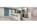 Stylish kitchen with a large center island, stainless steel appliances, and sleek gray cabinetry at 4 Willow Run Crse, Ocala, FL 34472