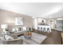 Open living space with modern décor, including plush seating and a kitchen bar at 461 Brentwood Dr, Daytona Beach, FL 32117