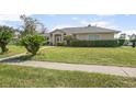 Attractive single-story home with mature landscaping at 710 Independence Dr, Orange City, FL 32763