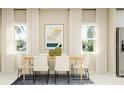 Elegant dining room with a modern table setting and lots of natural light at 7374 Ivy Tendril Ave, Orlando, FL 32829