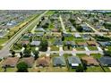 Expansive aerial view of the neighborhood, showcasing the community layout and residential homes at 130 Winsor Ave, Davenport, FL 33837