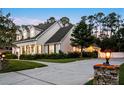 Beautiful residence featuring a well-maintained lawn, a spacious driveway, and an attached garage at 1443 Stone Trl, Enterprise, FL 32725