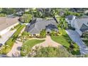 An aerial view of a well-manicured home showcasing its spacious lot and inviting pool area at 1455 Royal Forest Loop, Lakeland, FL 33811