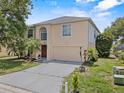 Charming home with a well-maintained lawn and two-car garage offers curb appeal at 1905 Emily Blvd, Winter Haven, FL 33884