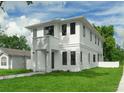 Striking two-story home with a clean, modern design and lush lawn at 2300 S Brown Ave, Orlando, FL 32806