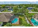 Aerial view of a fenced backyard featuring a screened-in pool at 2351 El Prado Ter, Deltona, FL 32725