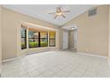 Bright and airy living room featuring tile floors and a large bay window at 2351 El Prado Ter, Deltona, FL 32725