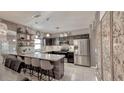 Modern kitchen featuring stainless steel appliances, hanging pendant lights, and bar stool seating at 376 Willet Street Willet St, Haines City, FL 33844