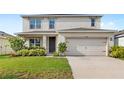 Charming two-story home featuring a two-car garage and well-maintained landscaping at 9024 Alba Ln, Kissimmee, FL 34747