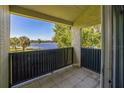Balcony showcasing serene lake views with swaying palm trees in the distance at 936 Lake Destiny Rd # G, Altamonte Springs, FL 32714