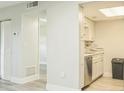 Bright kitchen with white cabinets, stainless steel appliances, and sleek countertops at 936 Lake Destiny Rd # G, Altamonte Springs, FL 32714
