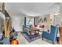 Inviting living room features tile floors, comfortable seating, and natural light at 10359 Smyrna Dr, Orlando, FL 32817