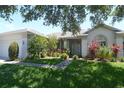 Beautiful one story home with manicured lawn and entryway landscaping at 1764 Carillon Park Dr, Oviedo, FL 32765