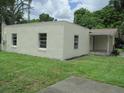 Exterior view of a home showing a well-manicured lawn and a covered entrance porch at 2112 Lee St, Orlando, FL 32805