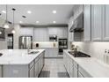 Modern kitchen boasts stainless steel appliances, ample cabinet space, and a bright, clean aesthetic at 2275 Pearl Cider St, Orlando, FL 32824