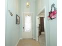 Inviting foyer featuring tile flooring and decorative lighting fixture at 2362 Prairie Dunes, Clermont, FL 34711