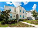 Striking two-story home showcasing contemporary architecture, complete with landscaped front yard and welcoming entryway at 2816 Simile St, Kissimmee, FL 34746