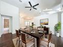 Bright dining room featuring modern table and chairs, with seamless flow to the kitchen and living areas at 4274 Meeting Pl, Sanford, FL 32773