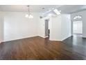 Bright living room featuring hardwood floors, modern lighting, and neutral color palette at 4274 Meeting Pl, Sanford, FL 32773