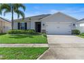 Attractive single-story home with a lush lawn and inviting curb appeal at 4564 Orchard Grove Rd, St Cloud, FL 34772