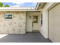 Inviting front entry showcasing a stained glass door and stone accents at 955 Tomes Ct, Orlando, FL 32825