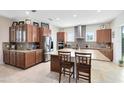 Spacious kitchen featuring stainless steel appliances, granite countertops, and ample cabinet space at 9978 Mere Pkwy, Orlando, FL 32832