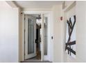Welcoming hallway featuring a modern design, unit number, and decorative artwork at 111 E Monument Ave # 801, Kissimmee, FL 34741
