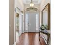 Inviting foyer with hardwood floors, high ceilings, and elegant decor at 13478 Summer Rain Dr, Orlando, FL 32828