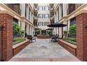 Charming courtyard featuring a fountain, seating, and lush greenery for a relaxing outdoor space at 140 E Morse Blvd # C, Winter Park, FL 32789