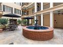 Tranquil courtyard with a central fountain, comfortable seating, and mature plants creating a peaceful retreat at 140 E Morse Blvd # C, Winter Park, FL 32789