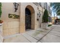 Elegant entryway with stone surround, decorative iron gate, and manicured landscaping providing a welcoming entrance at 140 E Morse Blvd # C, Winter Park, FL 32789