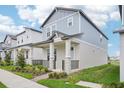 Stylish two-story home showcasing modern architectural design and well-maintained lawn at 16526 Silver Brook Way, Winter Garden, FL 34787