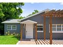 Gray house featuring a pergola and white trim at 1921 Dartmouth Ave, Winter Park, FL 32789