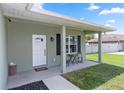 Inviting front porch with cozy seating area and decorative accents. This home welcomes you at 2305 Ascot Ave, Orlando, FL 32833