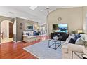Cozy living room featuring a vaulted ceiling, skylights, and an open floor plan at 2737 Cahill Way, Lake Mary, FL 32746
