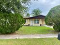 Traditional-style home with a neat front yard and curb appeal at 4394 Prince Hall Blvd, Orlando, FL 32811