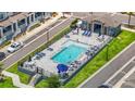 Community pool area with plenty of seating, umbrellas, and a central swimming pool at 452 Diamond Dove Cv, Winter Springs, FL 32708