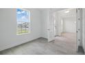 Clean, bright bedroom with natural light with double french doors and tile floors at 5204 Obsidian Gate Dr, Mount Dora, FL 32757
