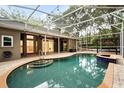 Enjoy the screened in pool with an attached hot tub for outdoor relaxation and entertainment at 917 Southern Oak Ln, Apopka, FL 32712