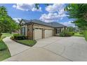 Spacious three-car garage and expansive driveway at 1224 Northern Way, Winter Springs, FL 32708