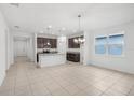 Spacious living area featuring an open layout, neutral tile flooring, and natural light at 1323 Wood Line Dr, Deland, FL 32720