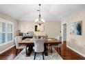Bright dining room featuring a decorative table set, chandelier, and natural light at 14634 Astina Way, Orlando, FL 32837