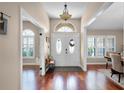 Inviting foyer showcasing the beautiful double doors with decorative glass and hardwood flooring at 14634 Astina Way, Orlando, FL 32837