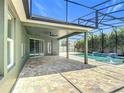 Outdoor patio and screened-in pool area ideal for entertaining or relaxing poolside at 1556 Alligator St, St Cloud, FL 34771
