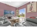 A stylish living room with a sliding glass door leading to the outdoors at 1797 Sundance Chase Rd, Minneola, FL 34715