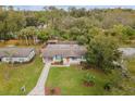 Spacious home with lush backyard, featuring a charming gazebo, mature trees, and a peaceful setting at 1945 Bering Ave, Winter Park, FL 32789