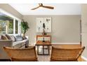 Cozy living room with large window, comfortable seating, hardwood floors, and stylish decor at 1945 Bering Ave, Winter Park, FL 32789