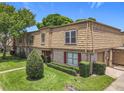 Charming townhome with mature landscaping, brick, siding, and attached garage at 200 St Andrews Blvd # 911, Winter Park, FL 32792